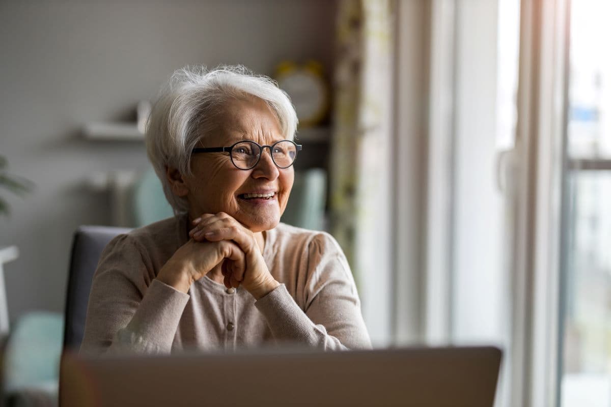 Why do my dentures feel like they are stretching the corners of my mouth when I take them out?