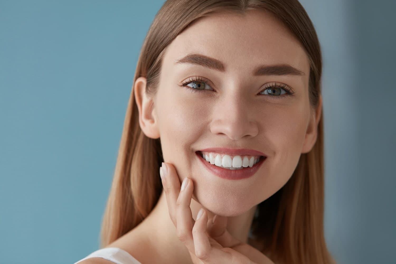 Can a Dentist Apply Composite Veneers Over Teeth That Already Have Small White Fillings?